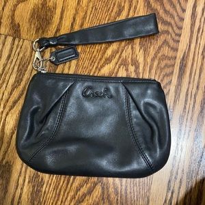 Very good condition black leather wristlet